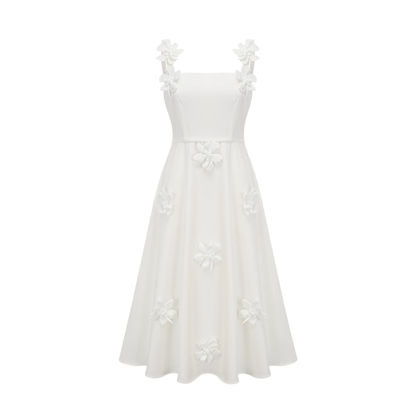 A woman wearing a white midi dress with a square neckline and faux flower embellishments standing in a neutral background