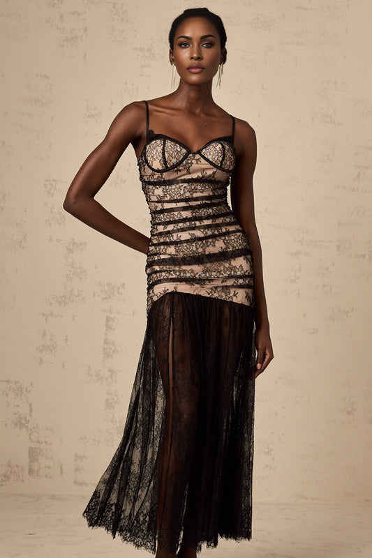 A woman wearing a white midi dress with floral embroidery lace details and ruffles along the bustier top and skirt