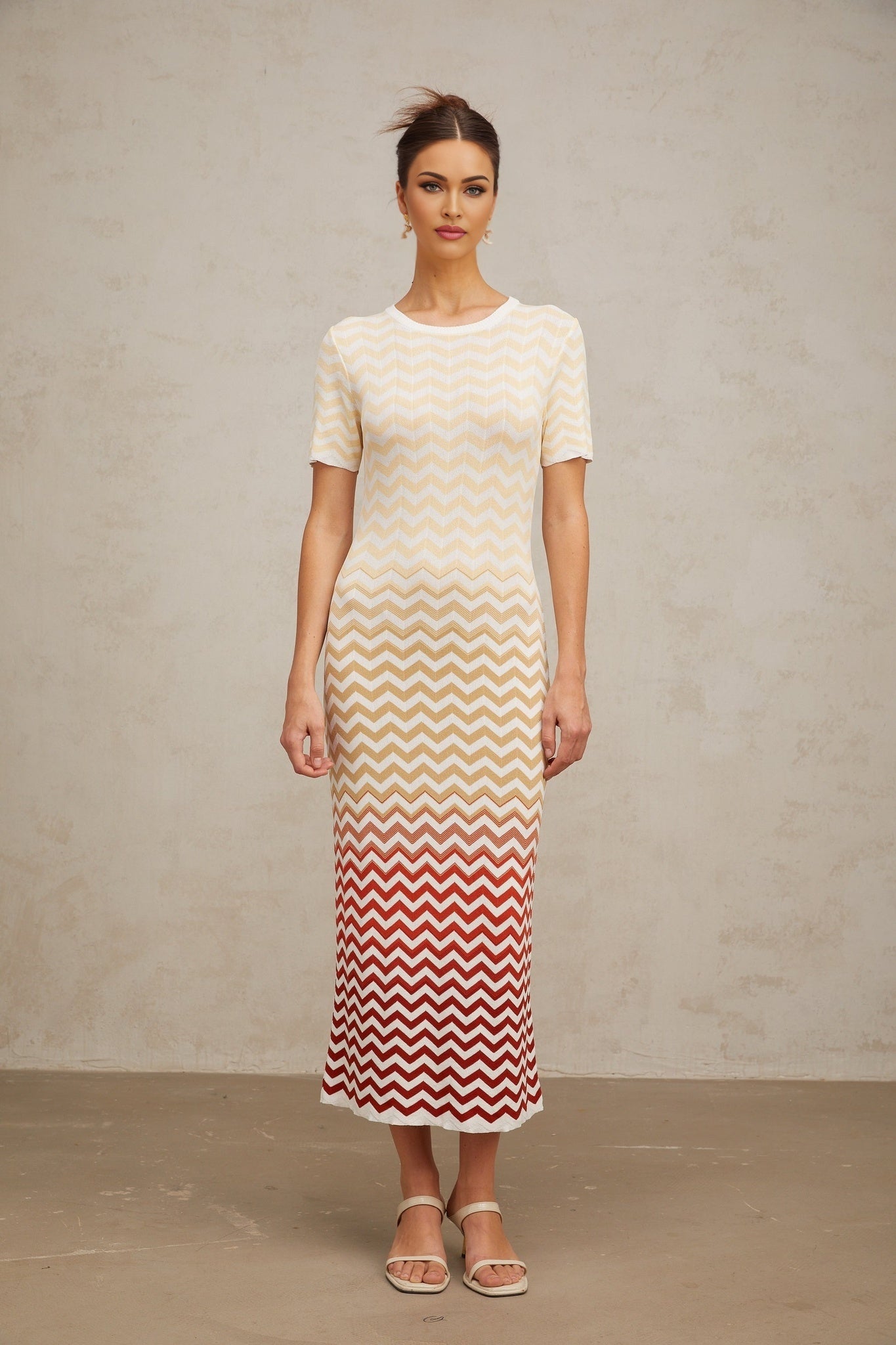 A yellow knit midi dress with a zigzag woven pattern named Isabelle
