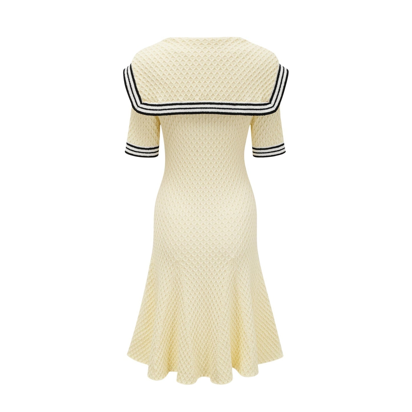 A yellow knitted dress with a sailor collar featuring a Madeleine style design