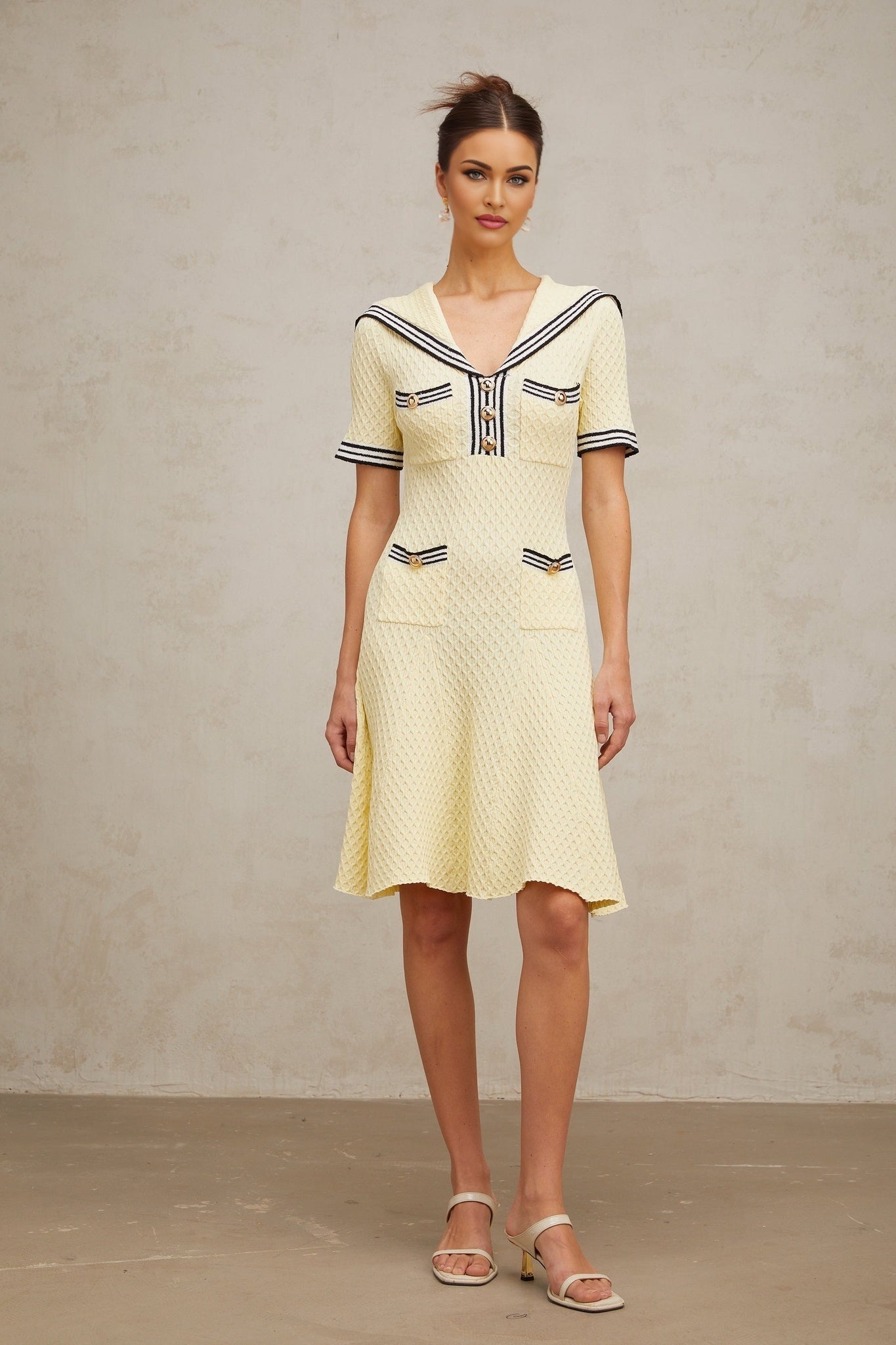A yellow knitted dress with a sailor collar Madeleine style