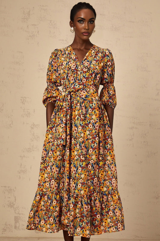 A yellow midi dress with a floral print and Vneck design called Eliane