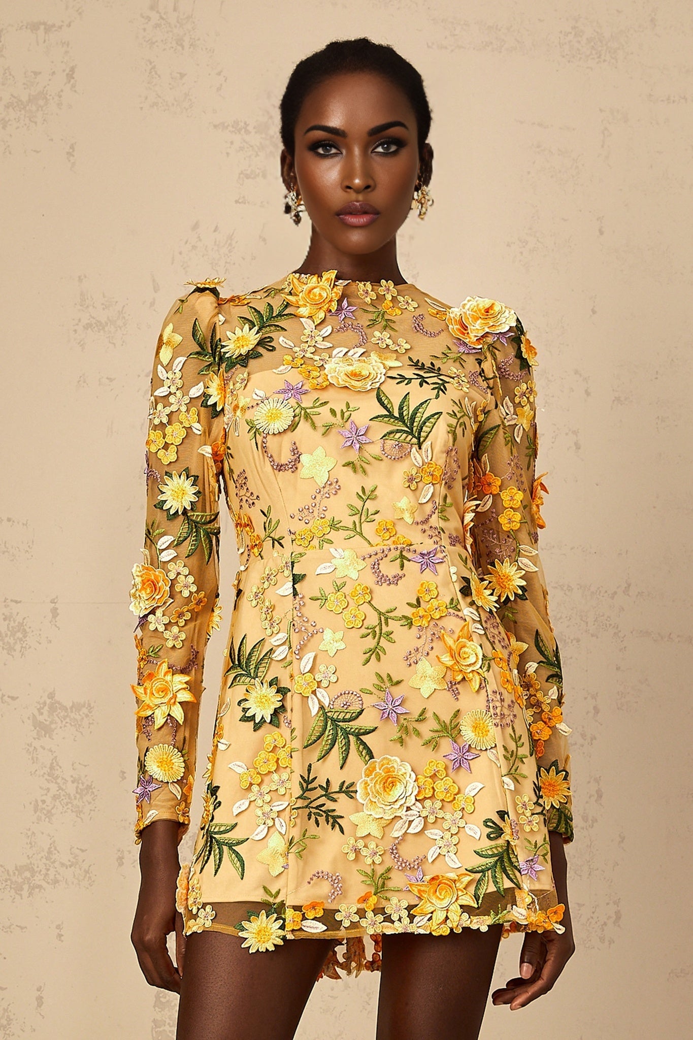 A yellow mini dress with 3D floral applique details named Jolien
