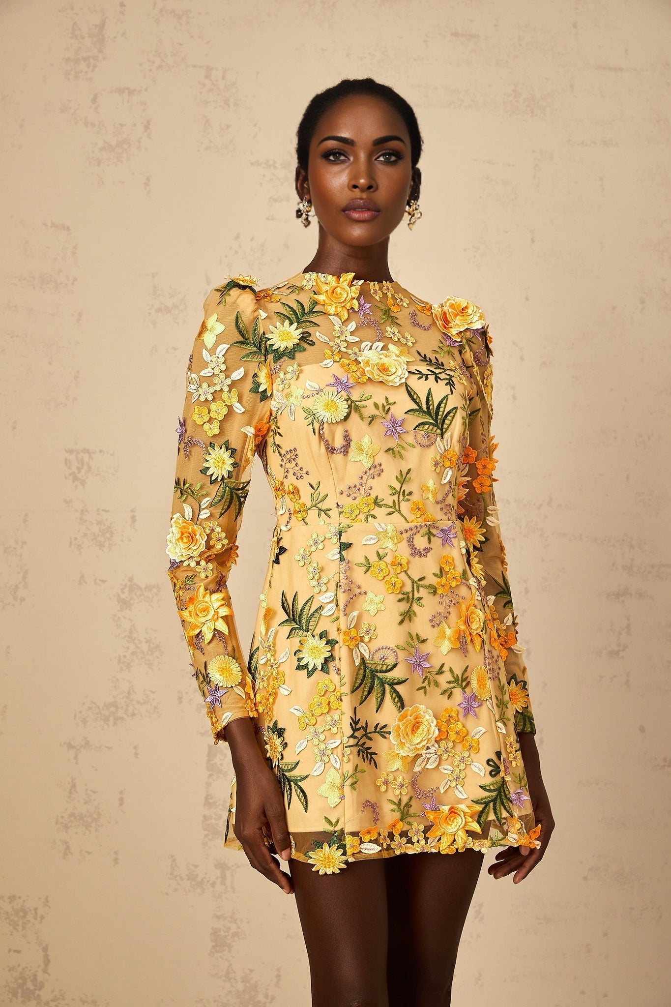 A yellow mini dress with 3D floral applique details named Jolien