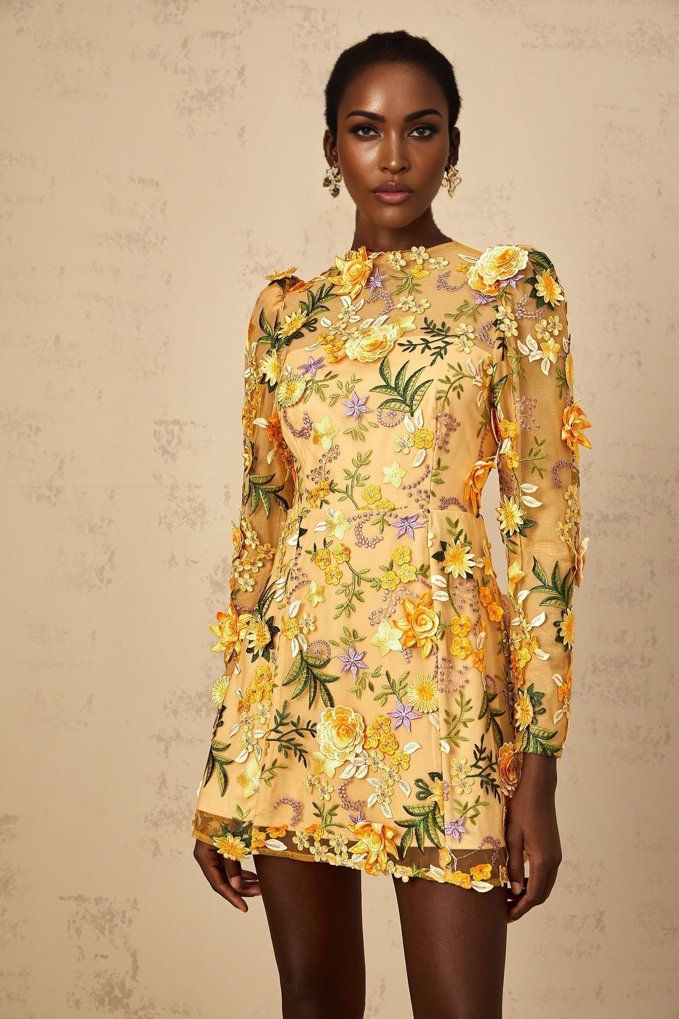A yellow mini dress with 3D floral applique details named Jolien