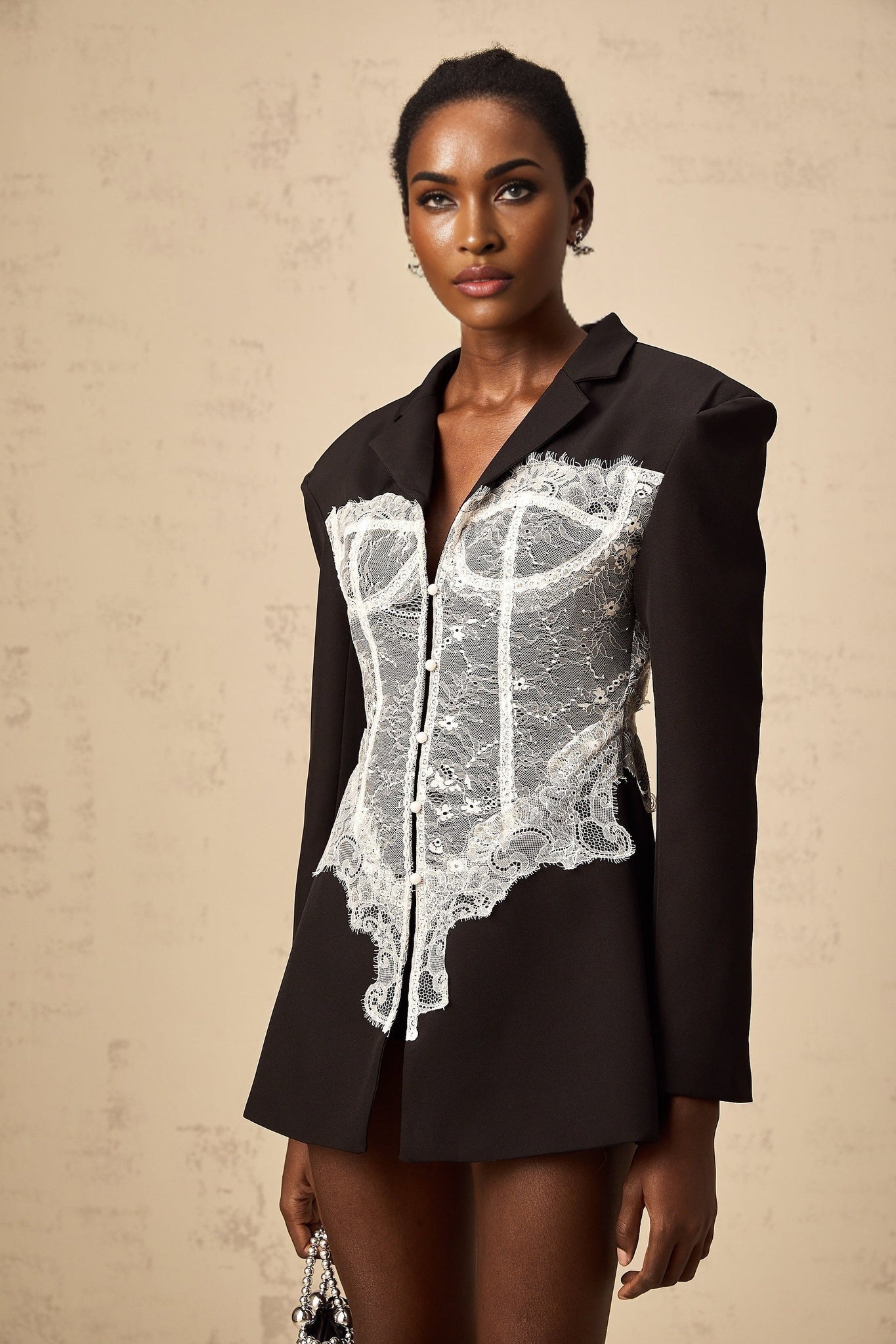 Alexia blazer featuring color blocking and lace panels on a white background