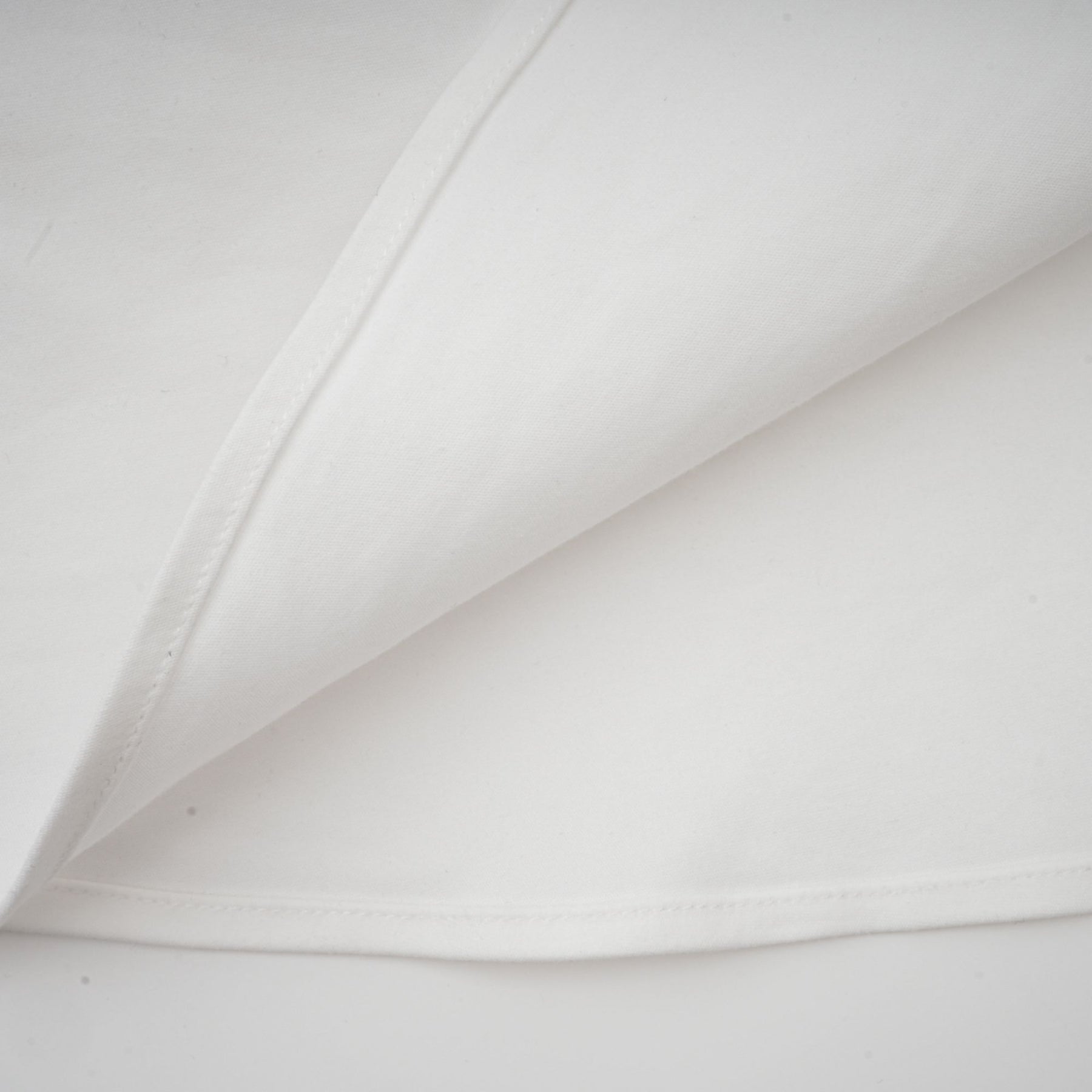 Alt text White pleated corset dress named Sadie featuring a fitted bodice and flared skirt