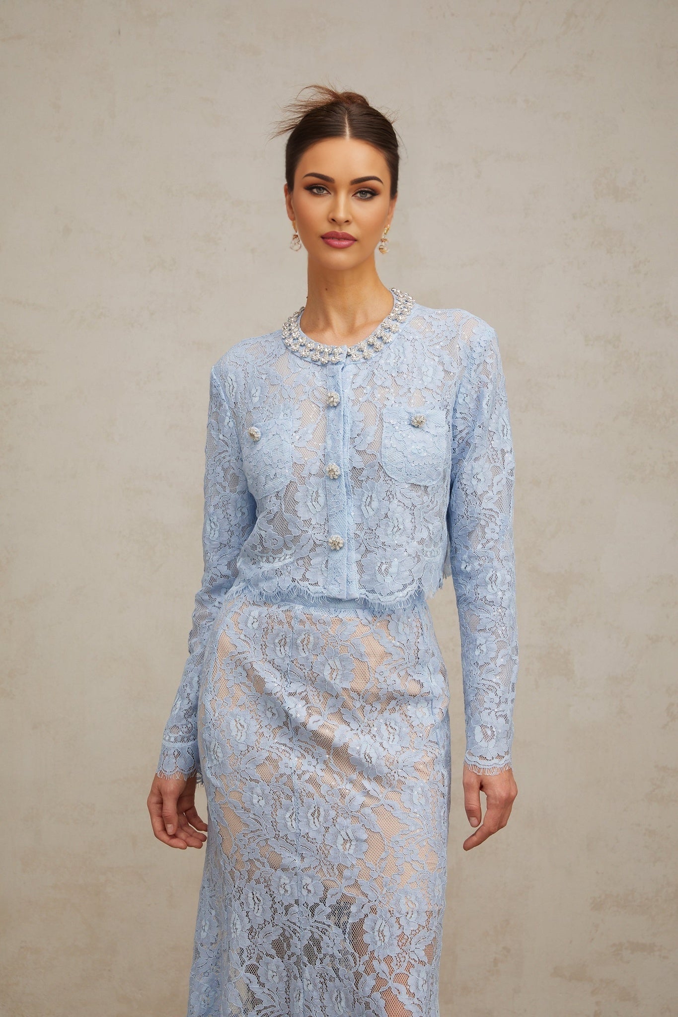 Ariane matching set with blue floral lace top and skirt on white background
