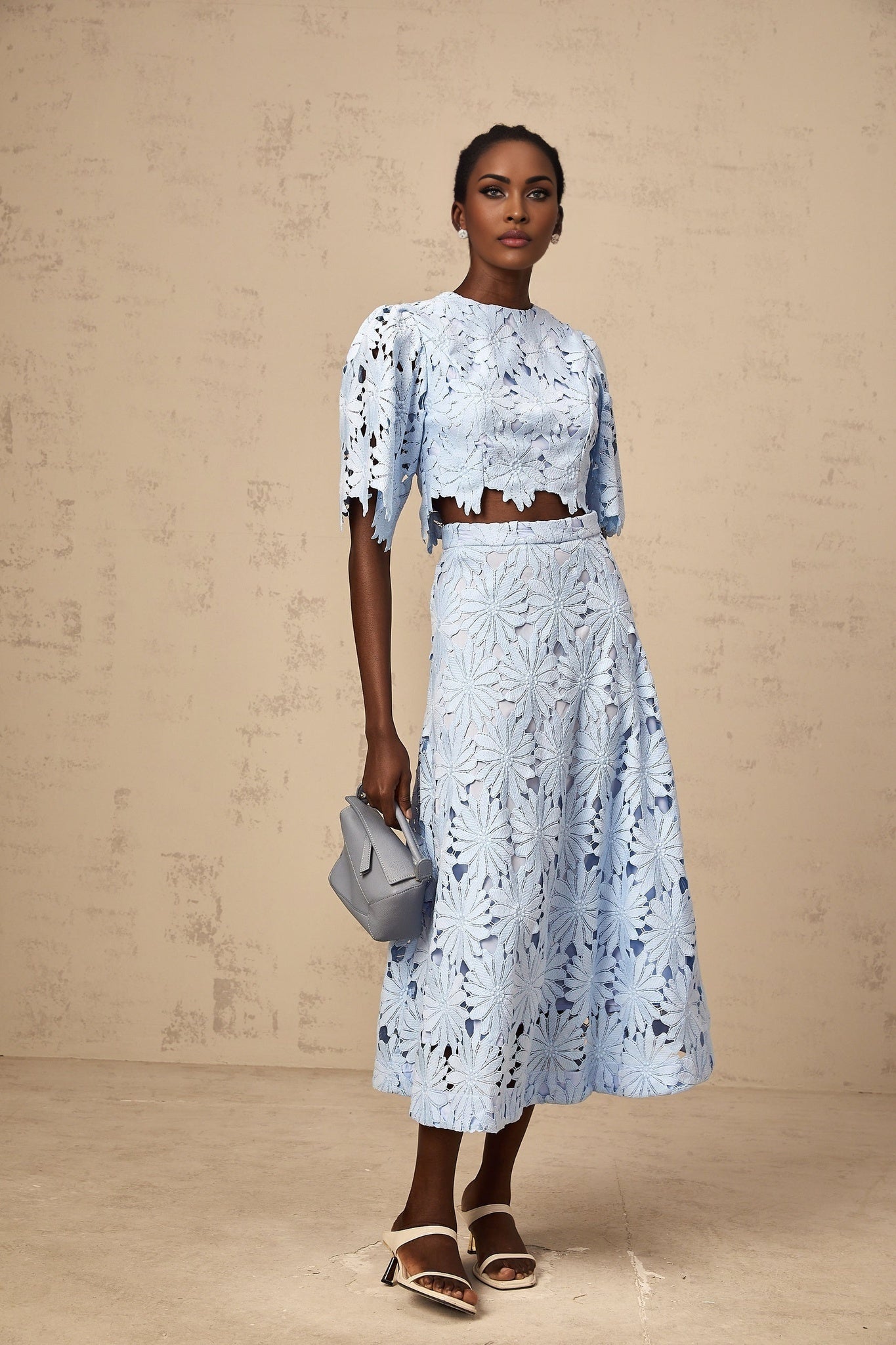 Audrey blue lace top and matching skirt set on white background