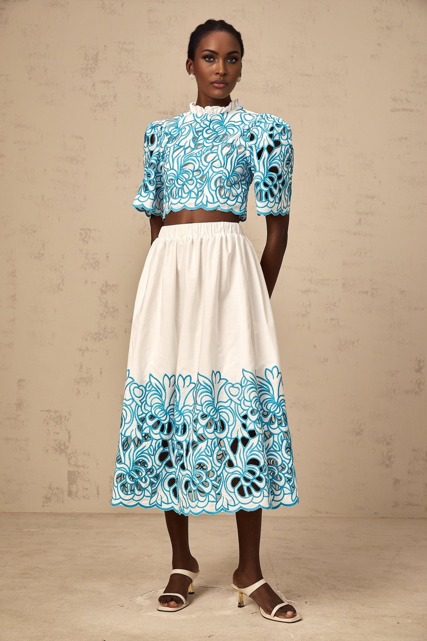 Aurore blue matching set featuring a cut out embroidered top and skirt