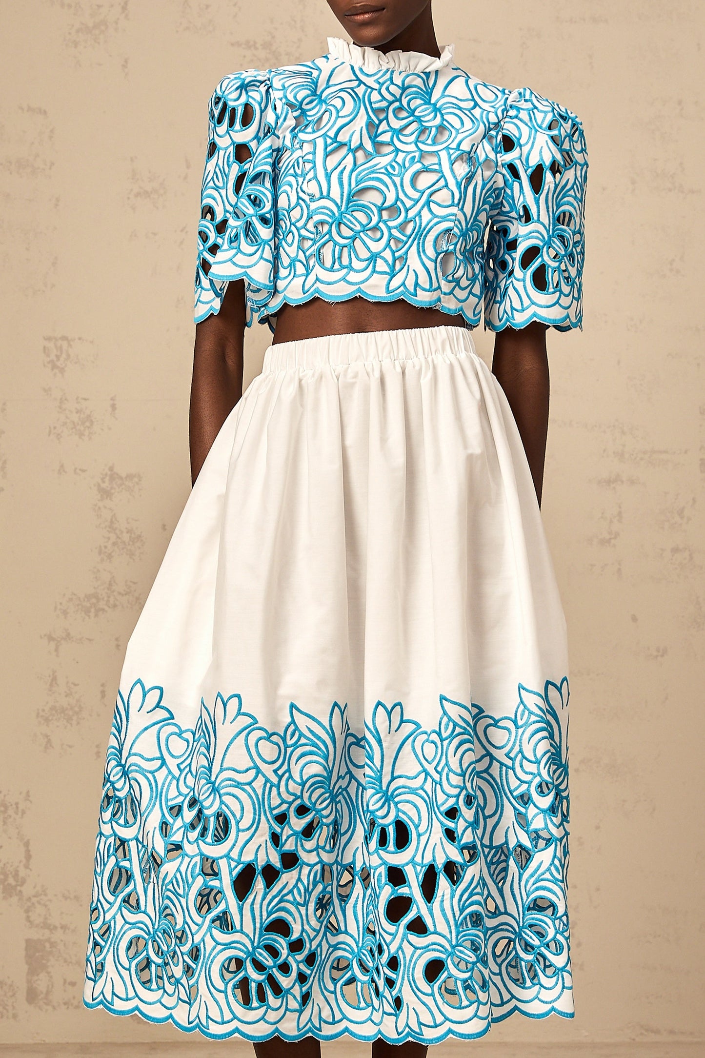 Aurore blue matching set featuring a cut out top and skirt with embroidery details