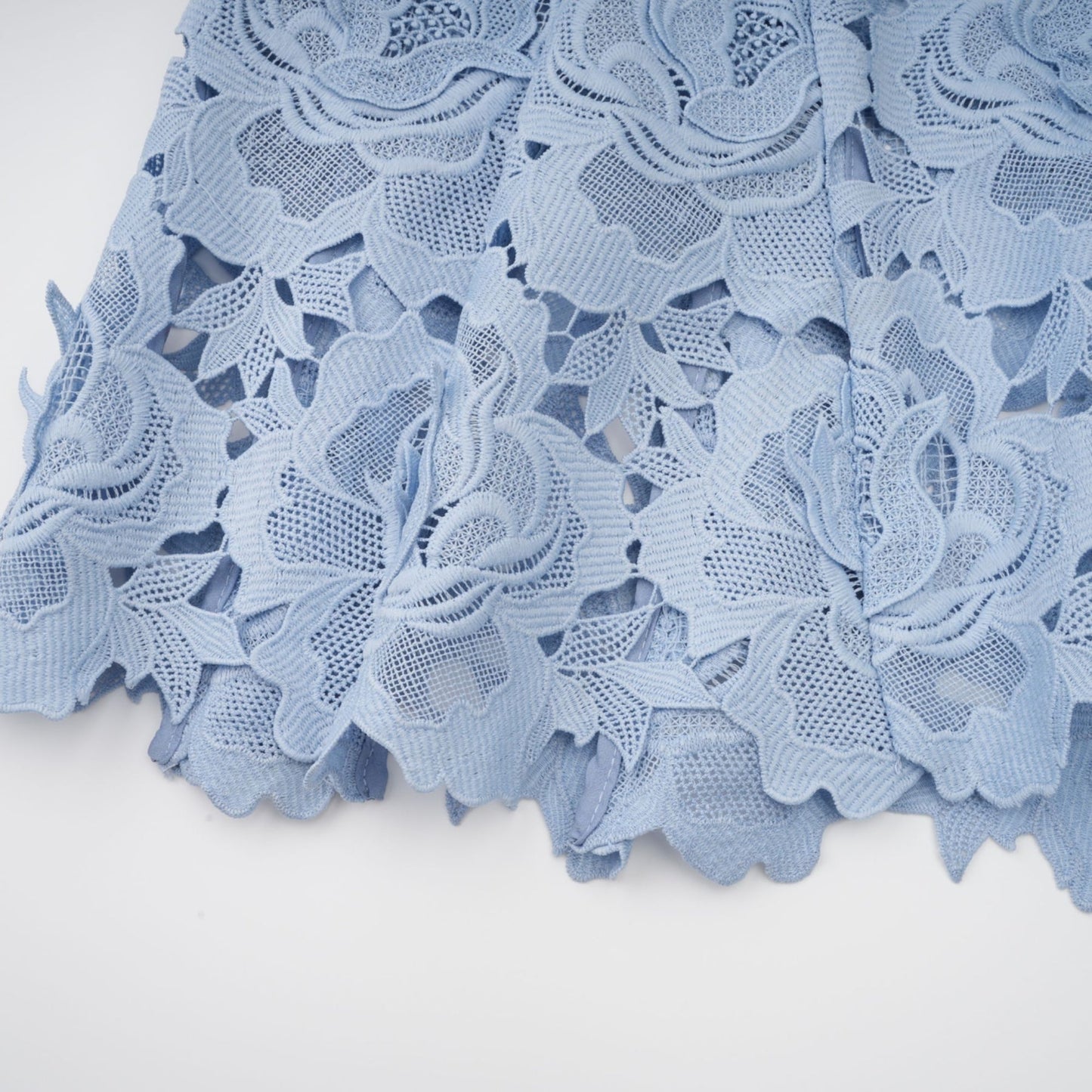 Aurore blue midi dress with delicate floral lace appliques covering the bodice and skirt