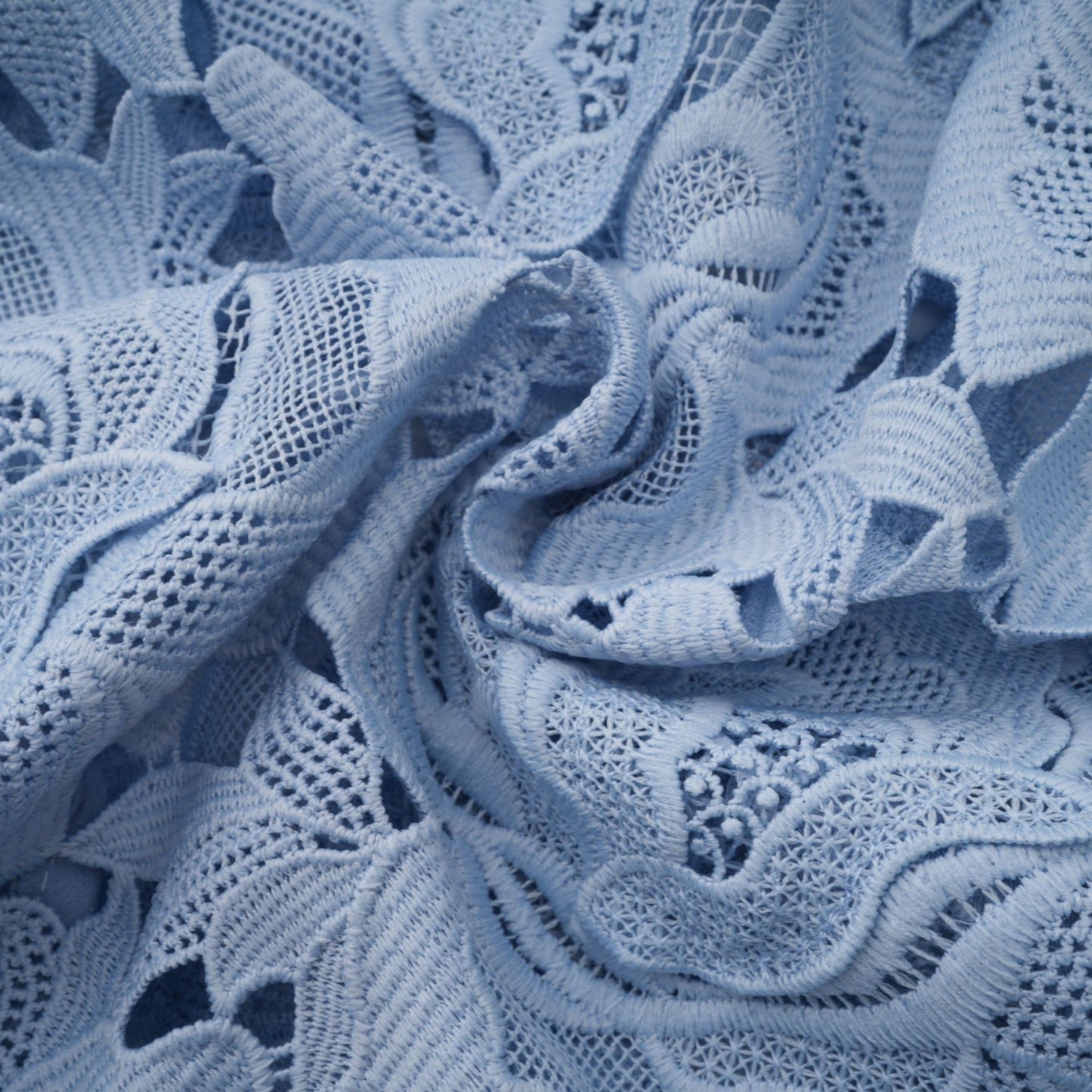 Aurore blue midi dress with delicate floral lace appliques covering the fabric