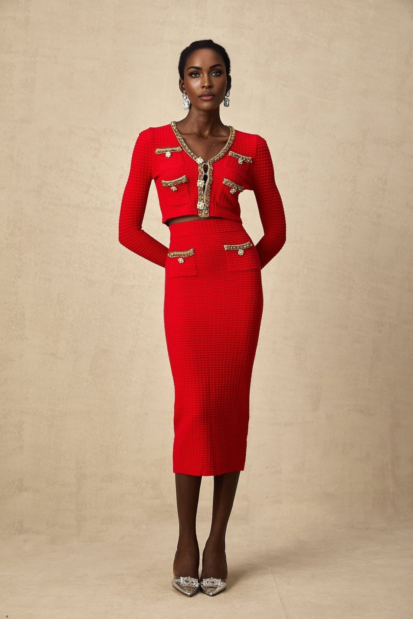 Axelle matching set featuring a red knitted cardigan and skirt with embellishments