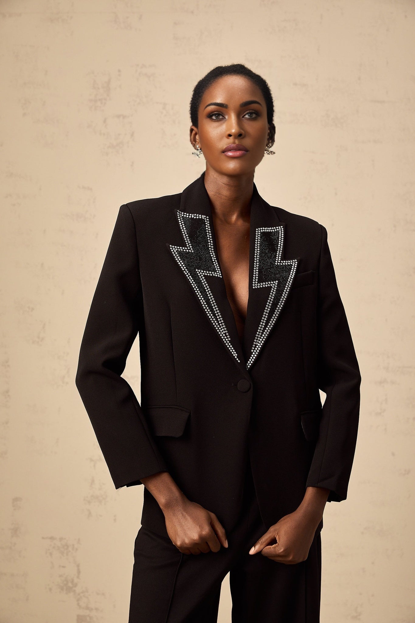 Black blazer with crystal embellishments in lightning bolt pattern