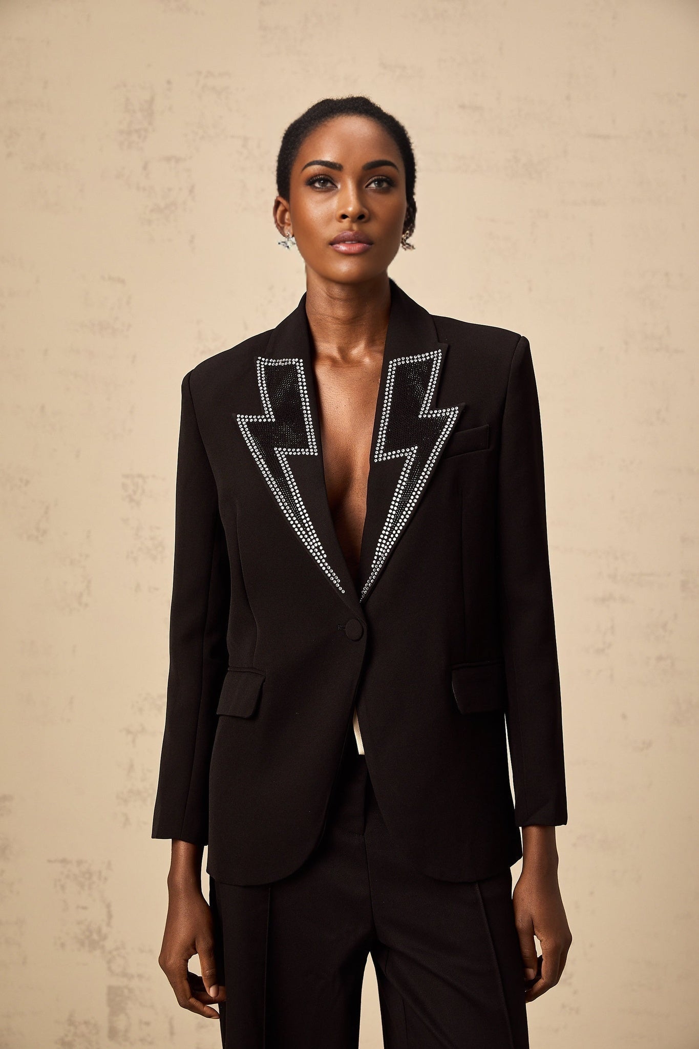 Black blazer with crystal lightning bolt embellishment on front