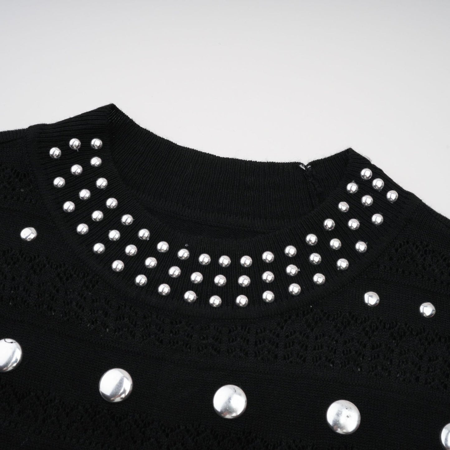 Black crochet knit maxi dress with studded details by Chloe