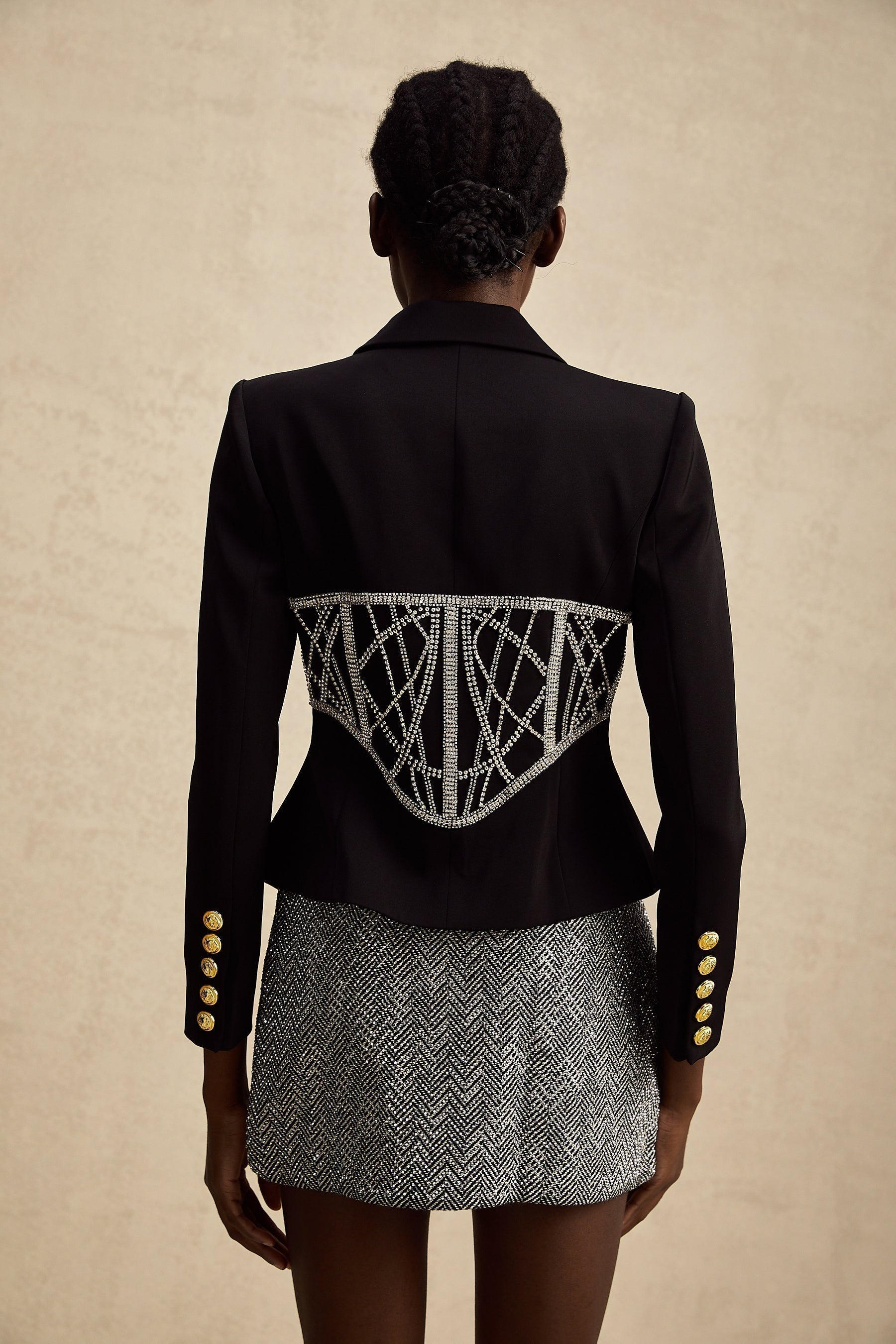Black fitted jacket with embellished details and cinched waist named Genevieve