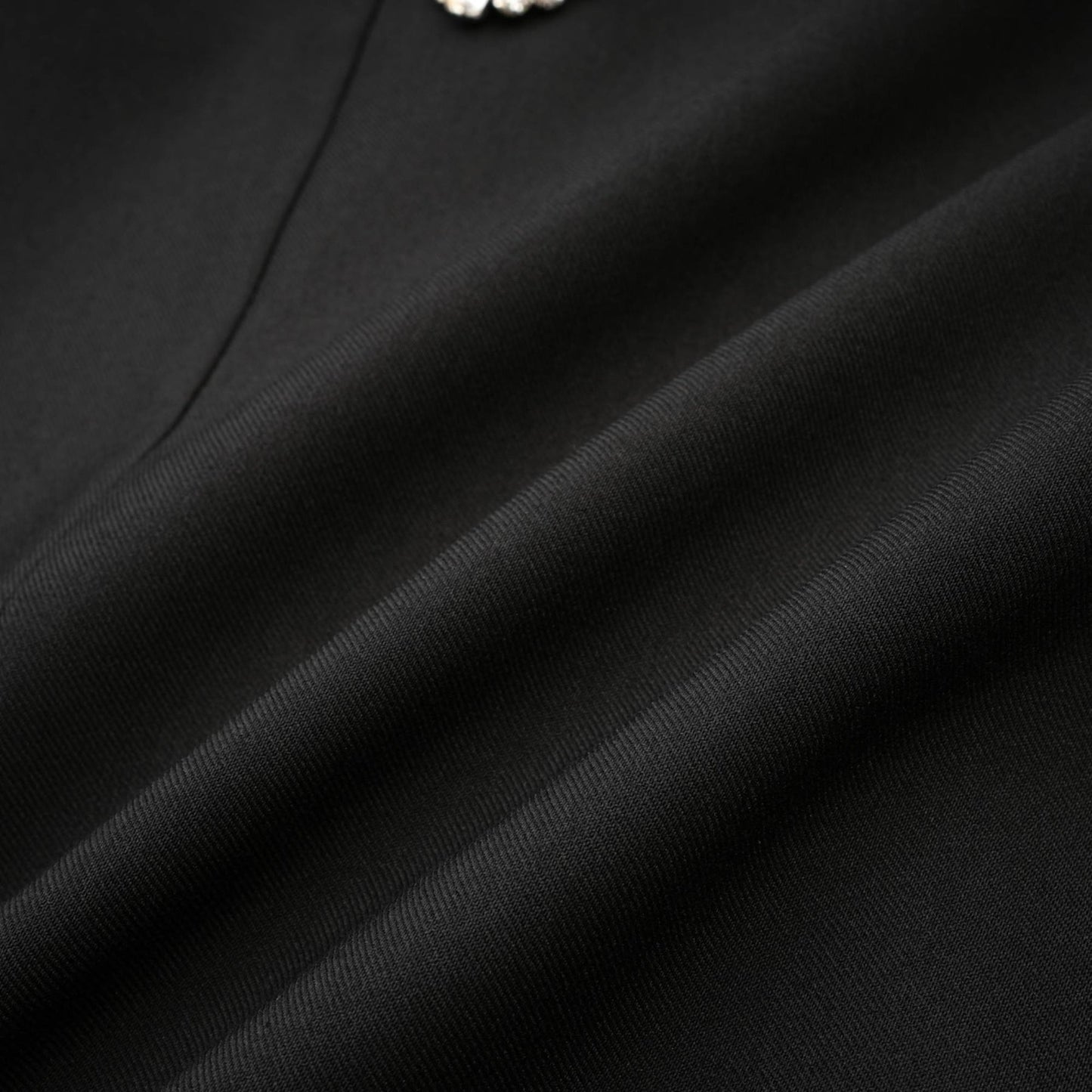 Black flared mini dress with crystal buttons named Mealla