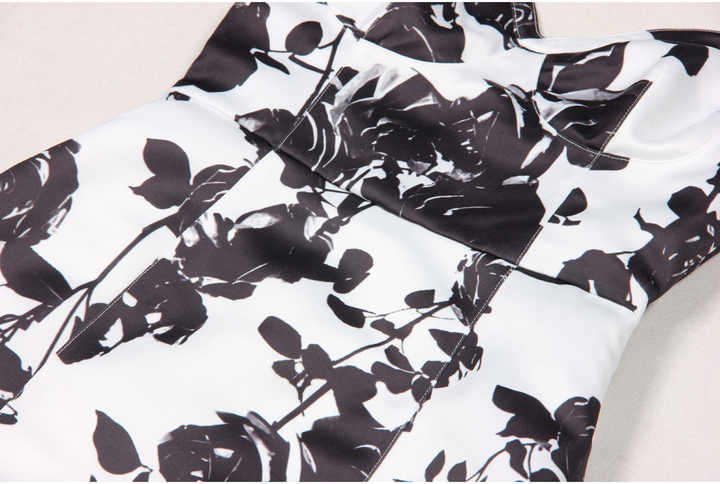 Black floral bodycon dress with halter neck on white background