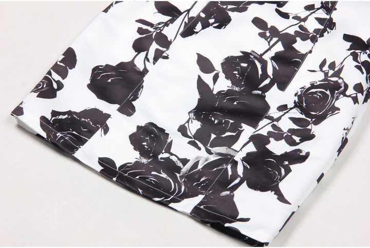Black floral bodycon dress with halter neck on white background