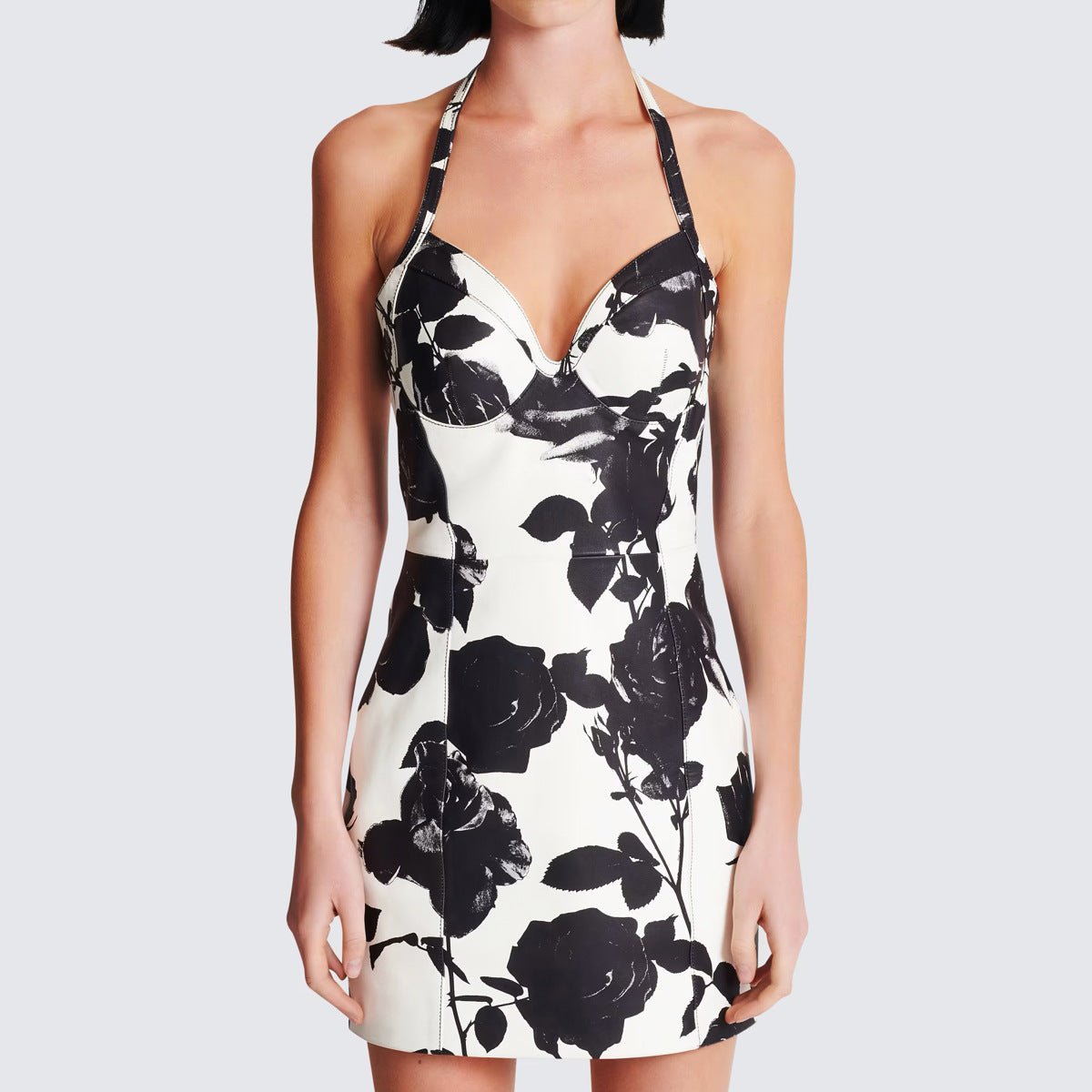 Black floral bodycon dress with halter neck on white background