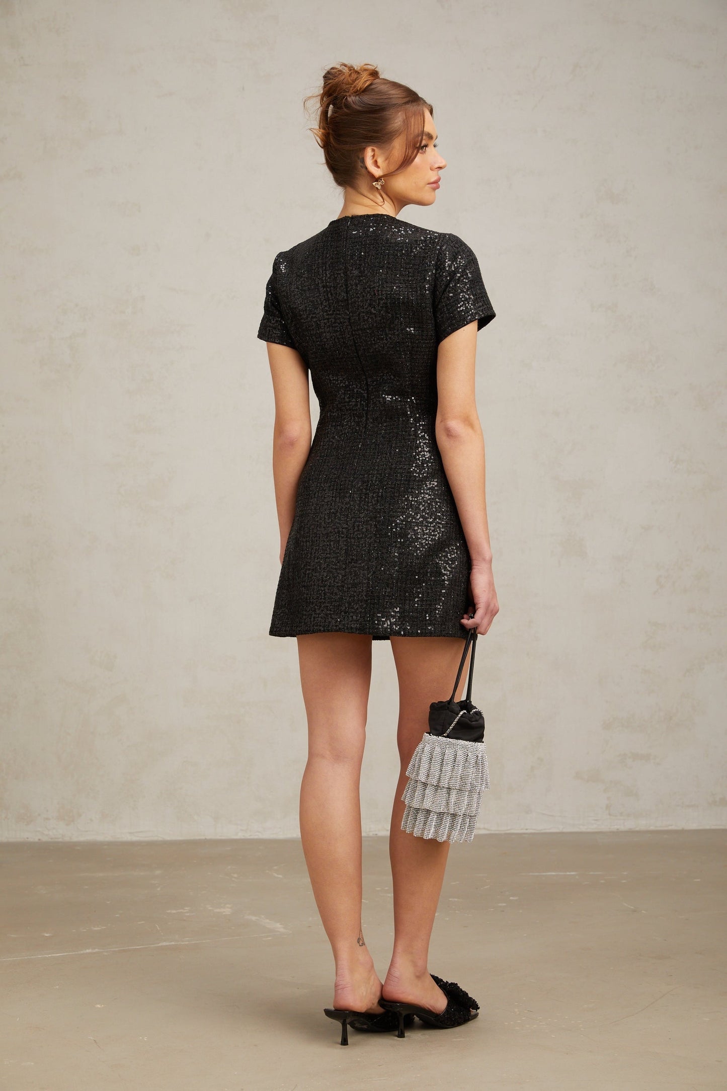 Black glittery mini dress with sparkly finish and short length