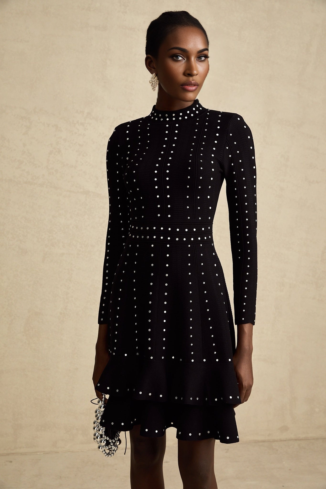 Black knitted mini dress with embellishments and ruffles named Fabienne