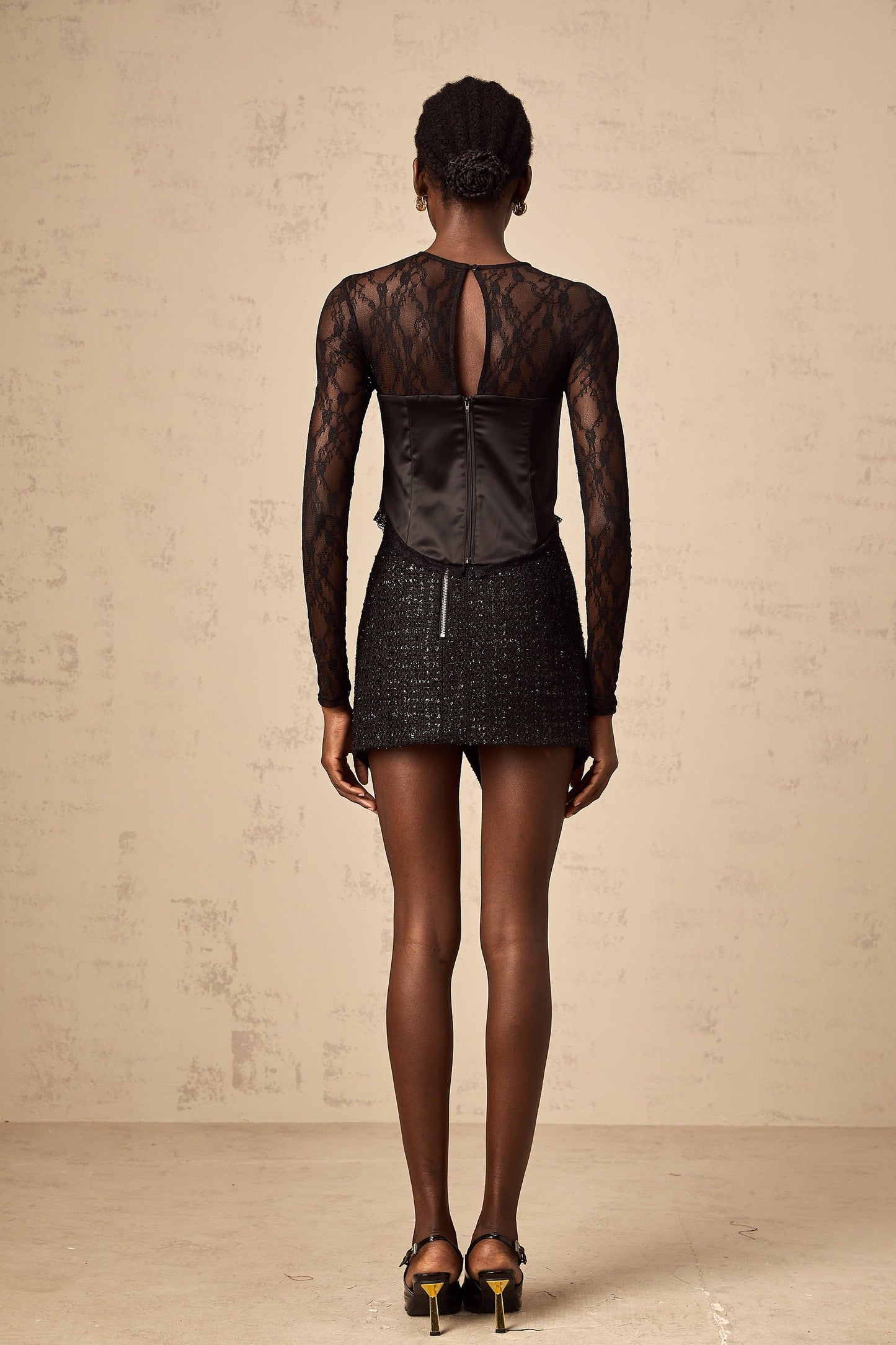 Black lace top with cutout details short sleeves and scoop neckline