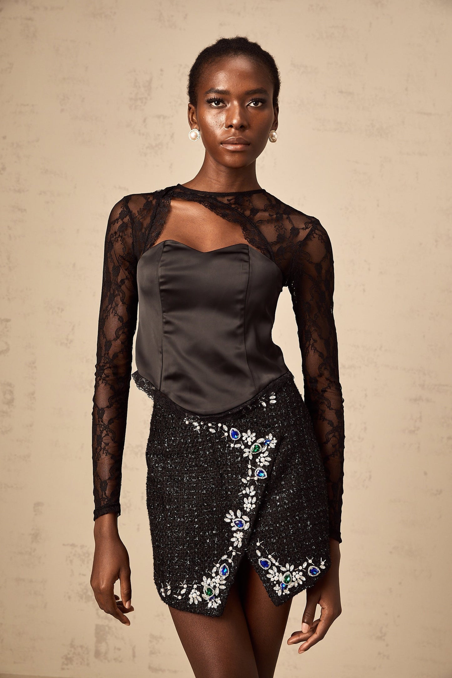 Black lace top with cutout details sleeveless design and intricate floral pattern