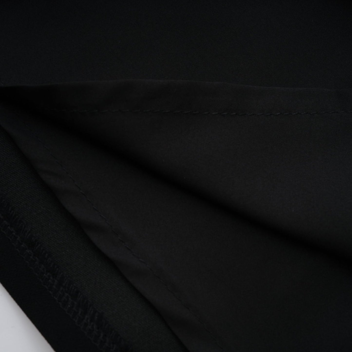 Black mini dress adorned with faux pearl embellishments