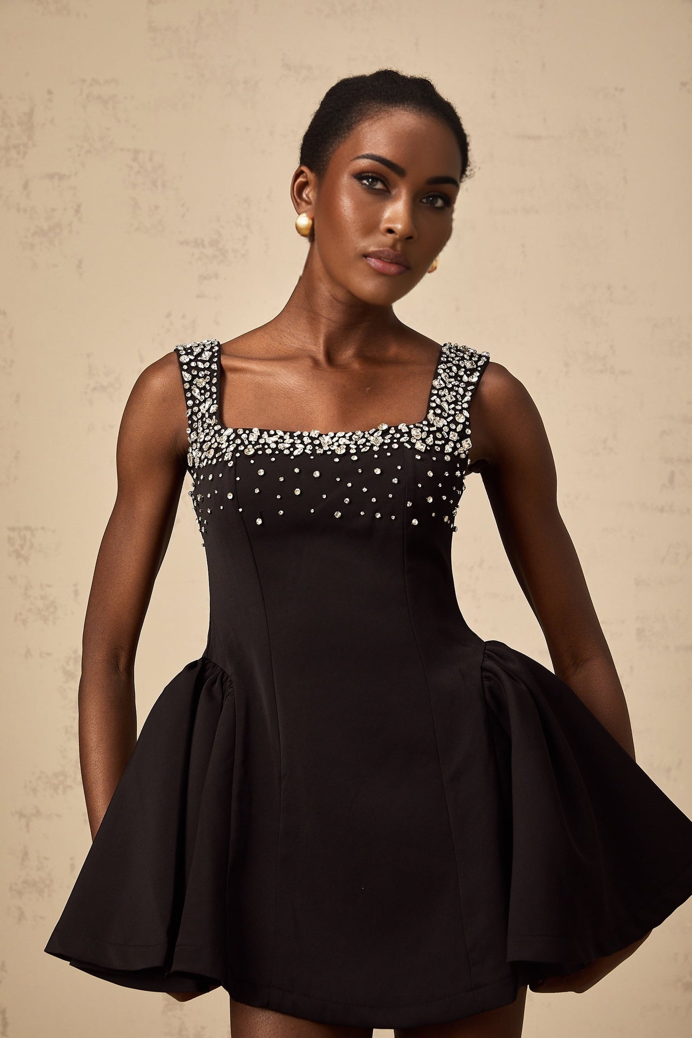 Black mini dress with flared skirt and crystal embellishments named Melanie