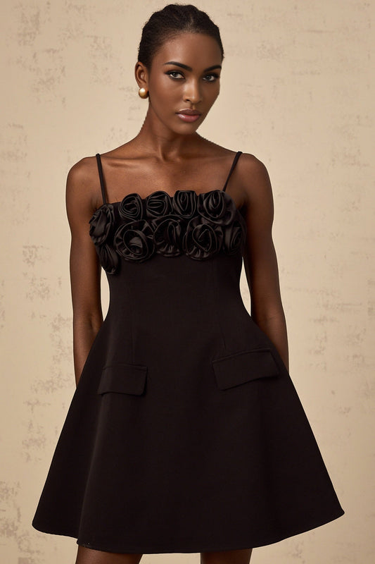Black mini dress with flared skirt and rose applique details