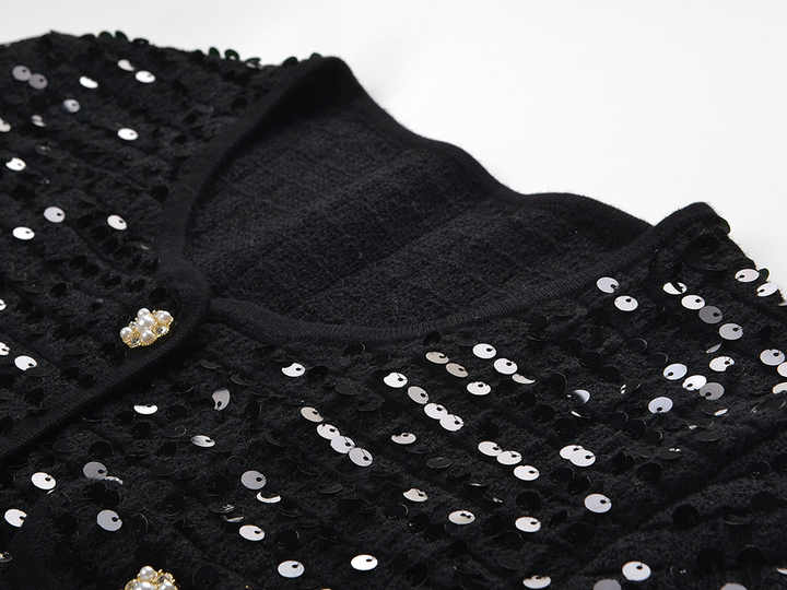 Black sequined cropped jacket with bejeweled buttons