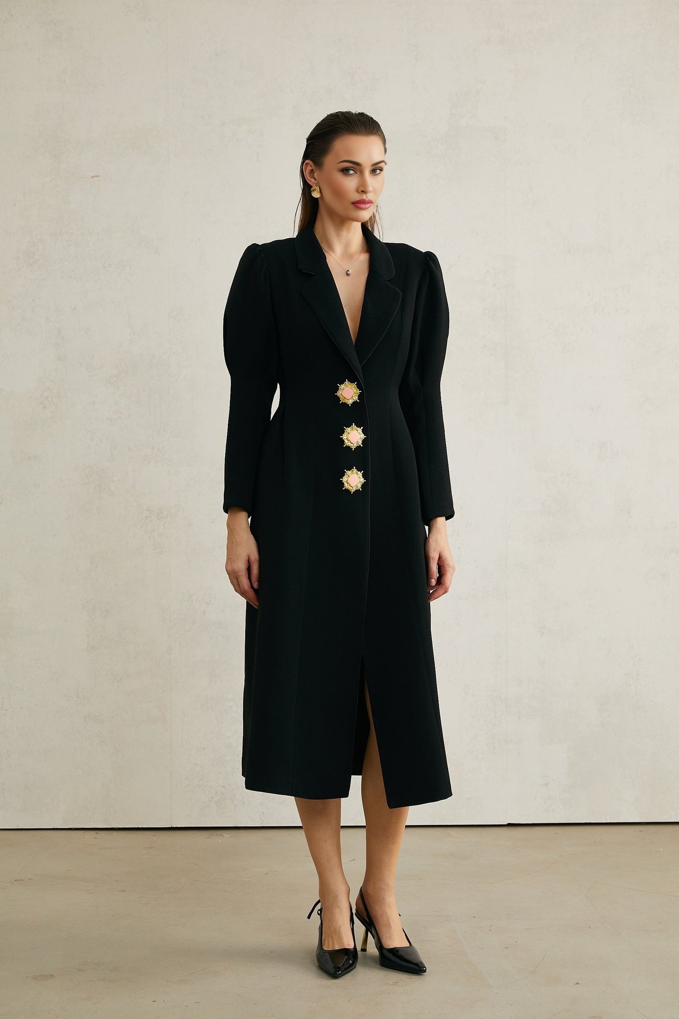 Black single breasted long coat by Aelle
