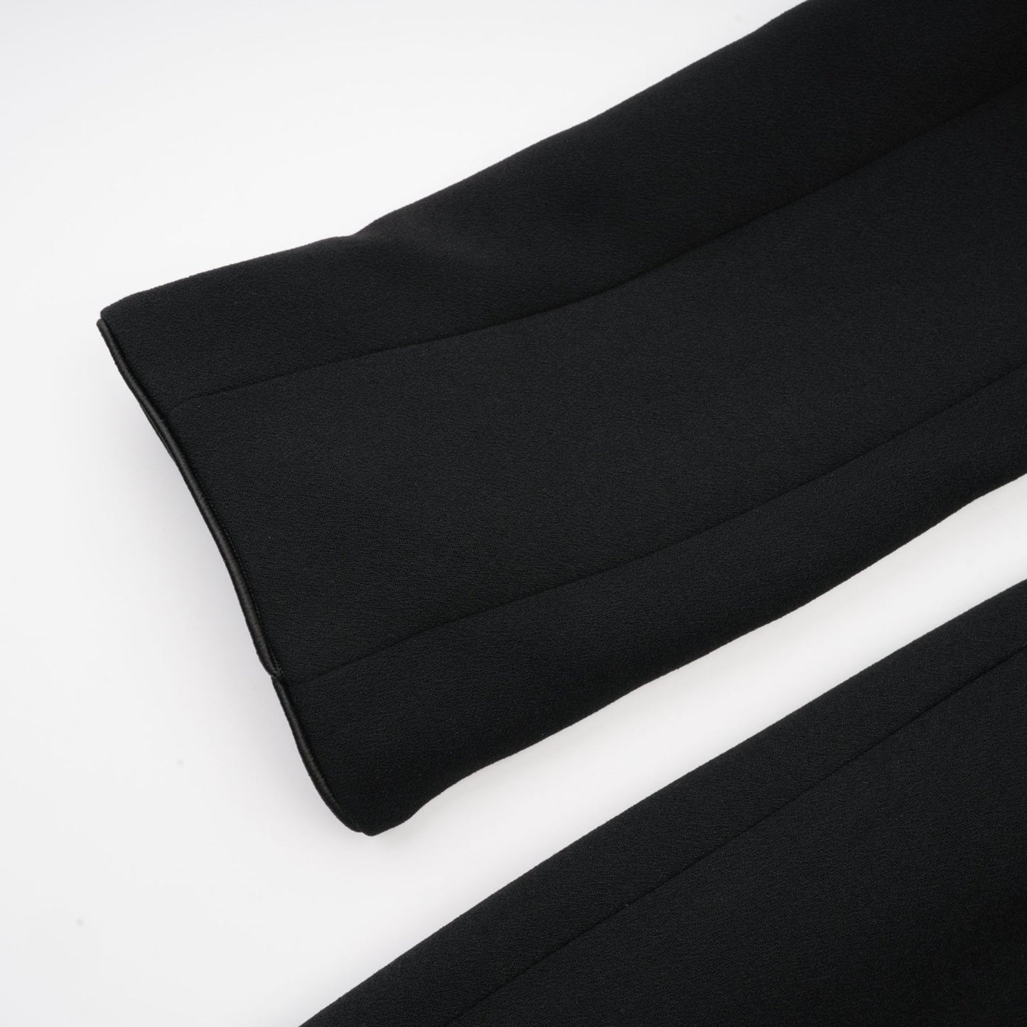 Black single breasted long coat by Aelle