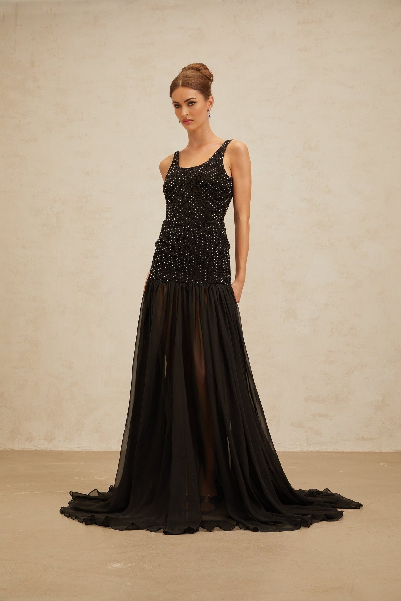 Black sleeveless scoop neck fitted top with rhinestone embellishment