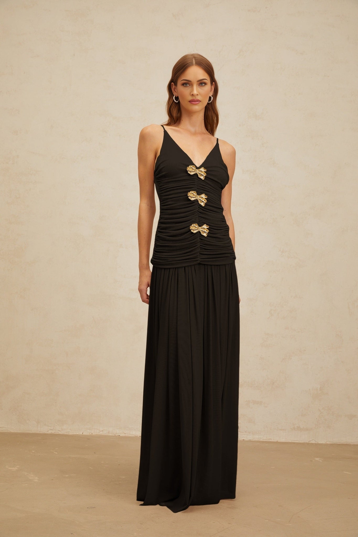 Black V-neck Sleeveless Top with Brooch and Ruched Detailing