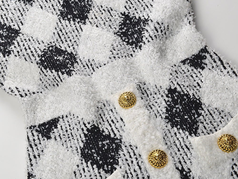 Black and white argyle pattern bodycon dress with golden button accents