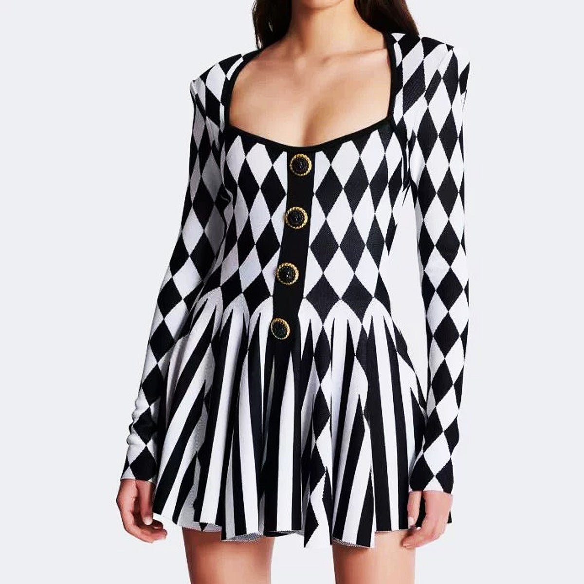 Black and white geometric harlequin pattern form-fitting dress with gold decorative buttons