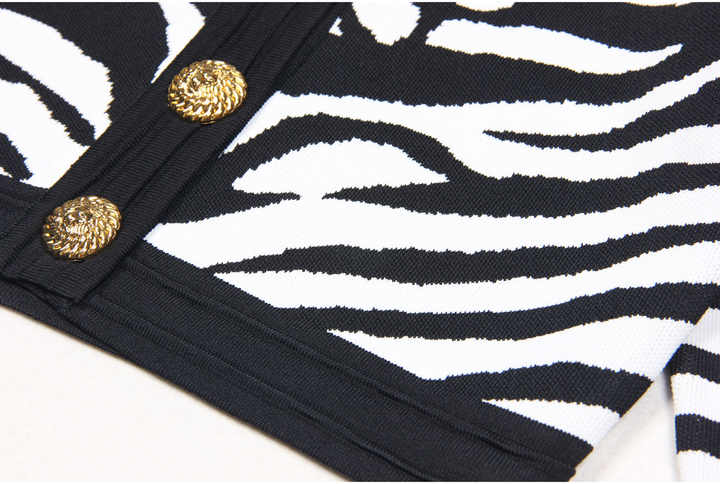 Black and white zebra print cropped cardigan with gold buttons