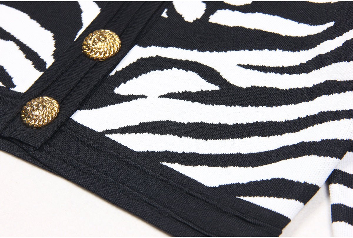 Black and white zebra print cropped cardigan with gold buttons