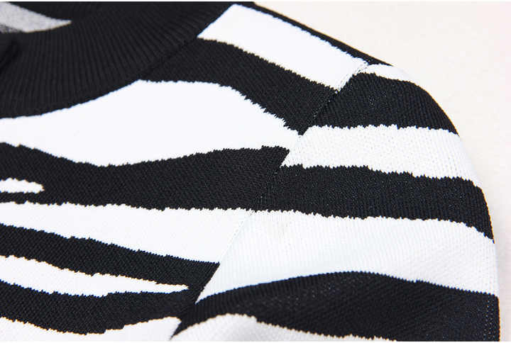 Black and white zebra print cropped sweater with gold buttons