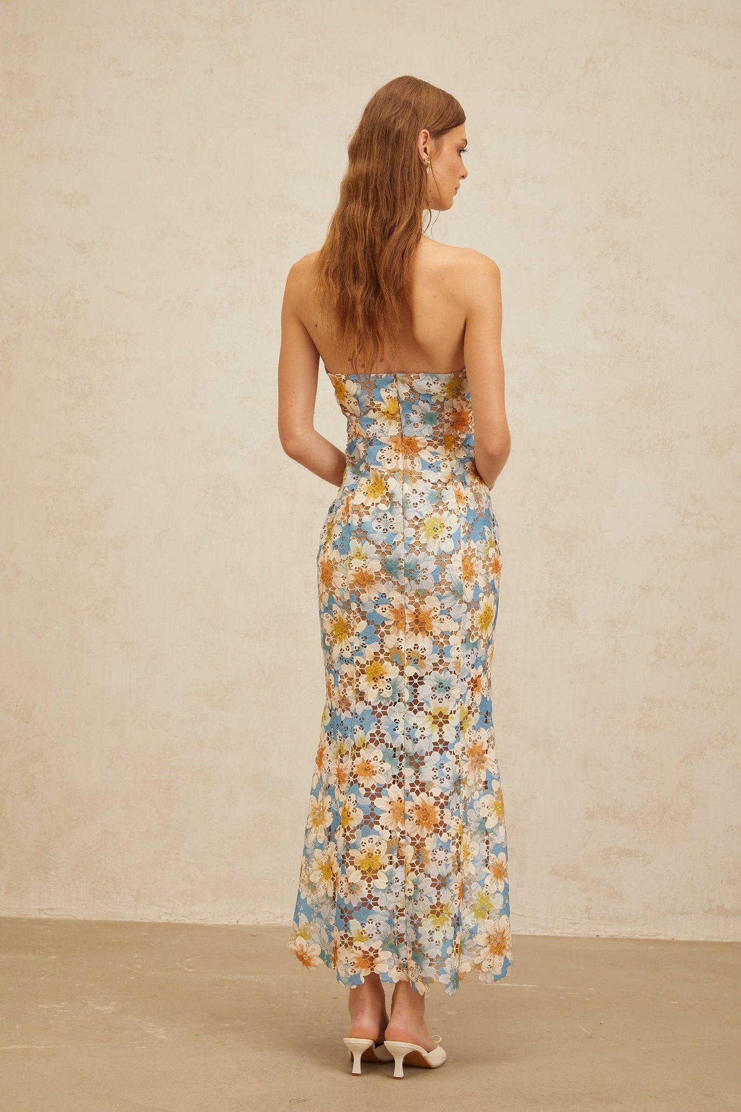 Blue halterneck sleeveless maxi dress with floral embroidery and cut-out design