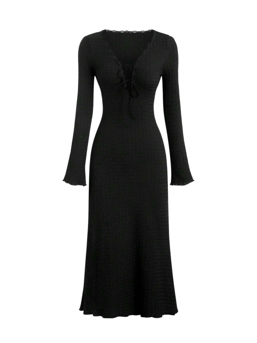 Black lace-up maxi dress with long sleeves and a flowing silhouette