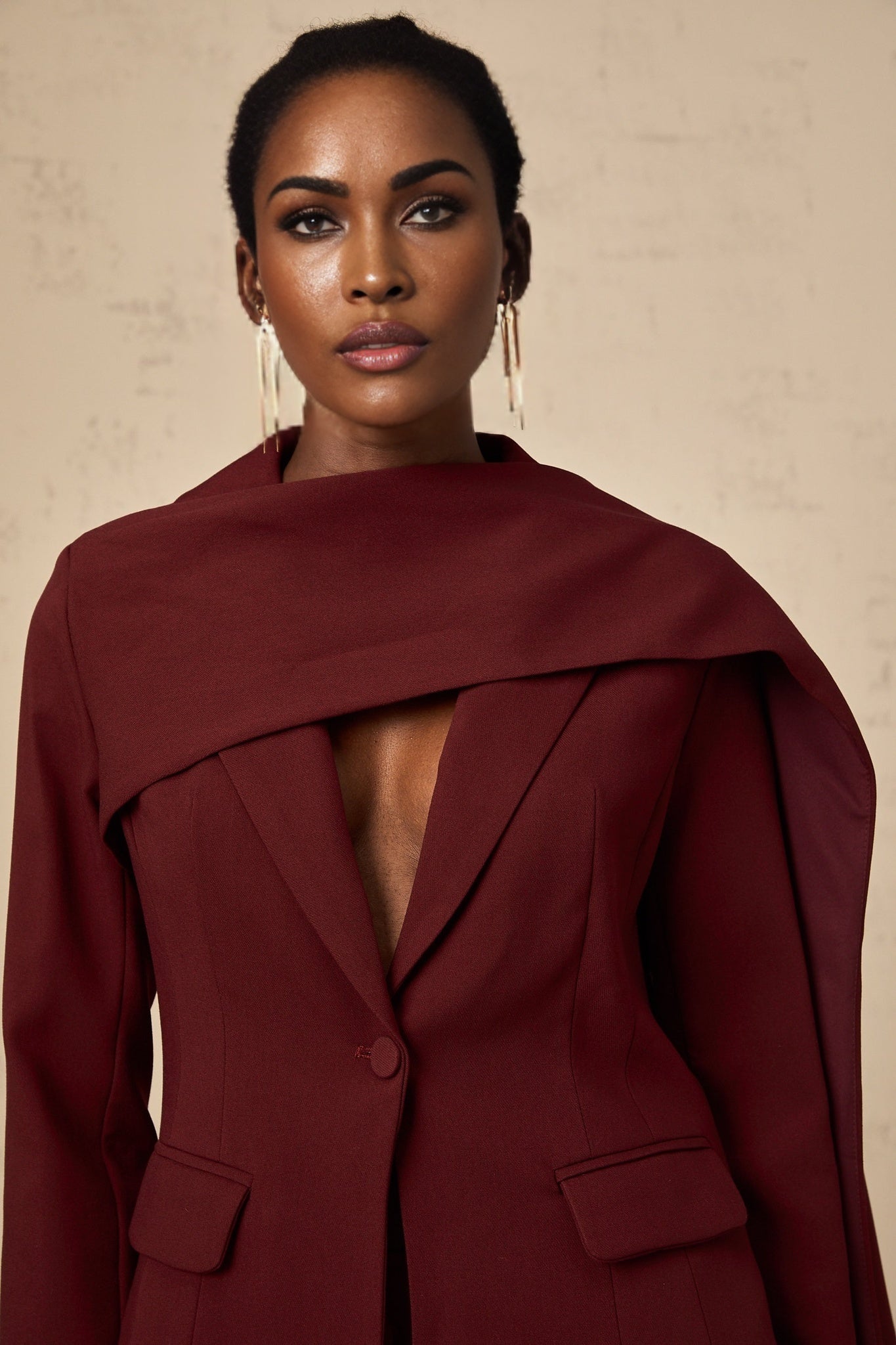 Burgundy colored Coralie jacket with shawl collar detail and long sleeves