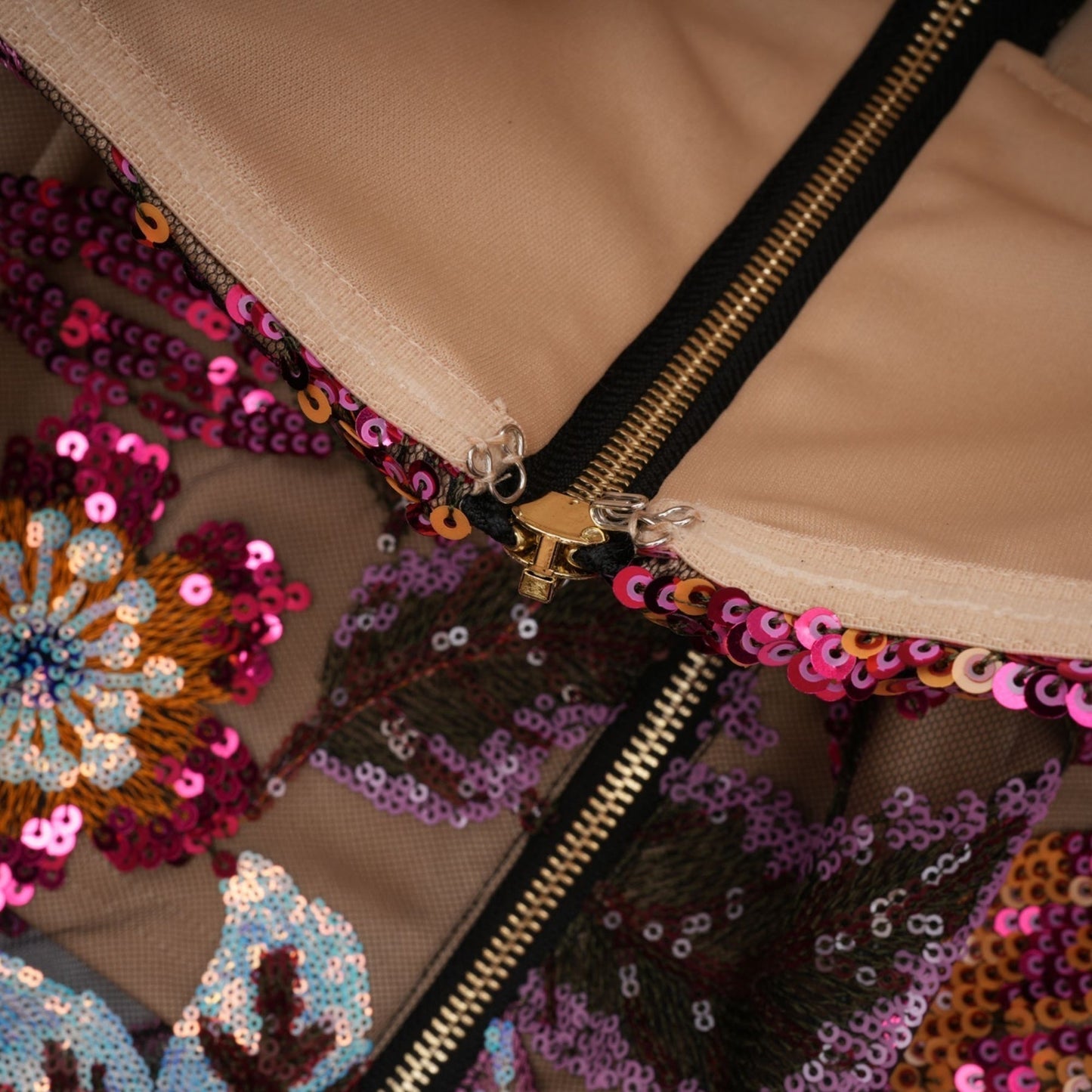 Colorful midi dress with floral embroidery and sequin embellishments designed by Therese