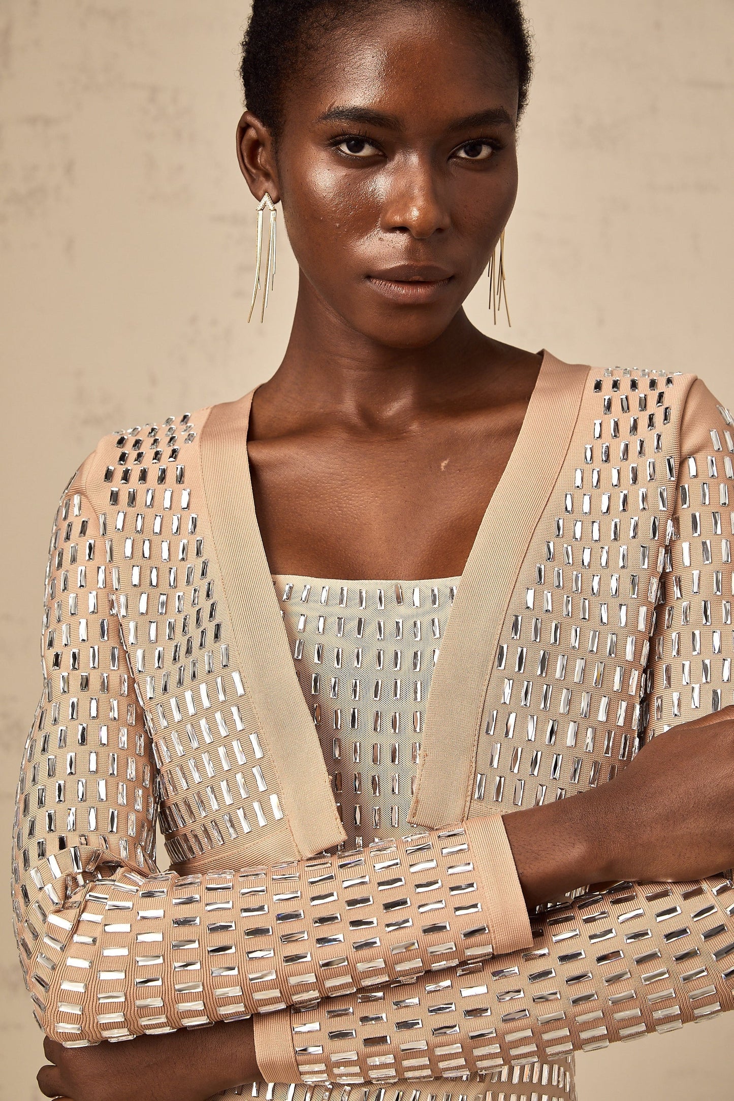 Cropped jacket with studs covering the surface in a decorative pattern featuring a structured silhouette and edgy design