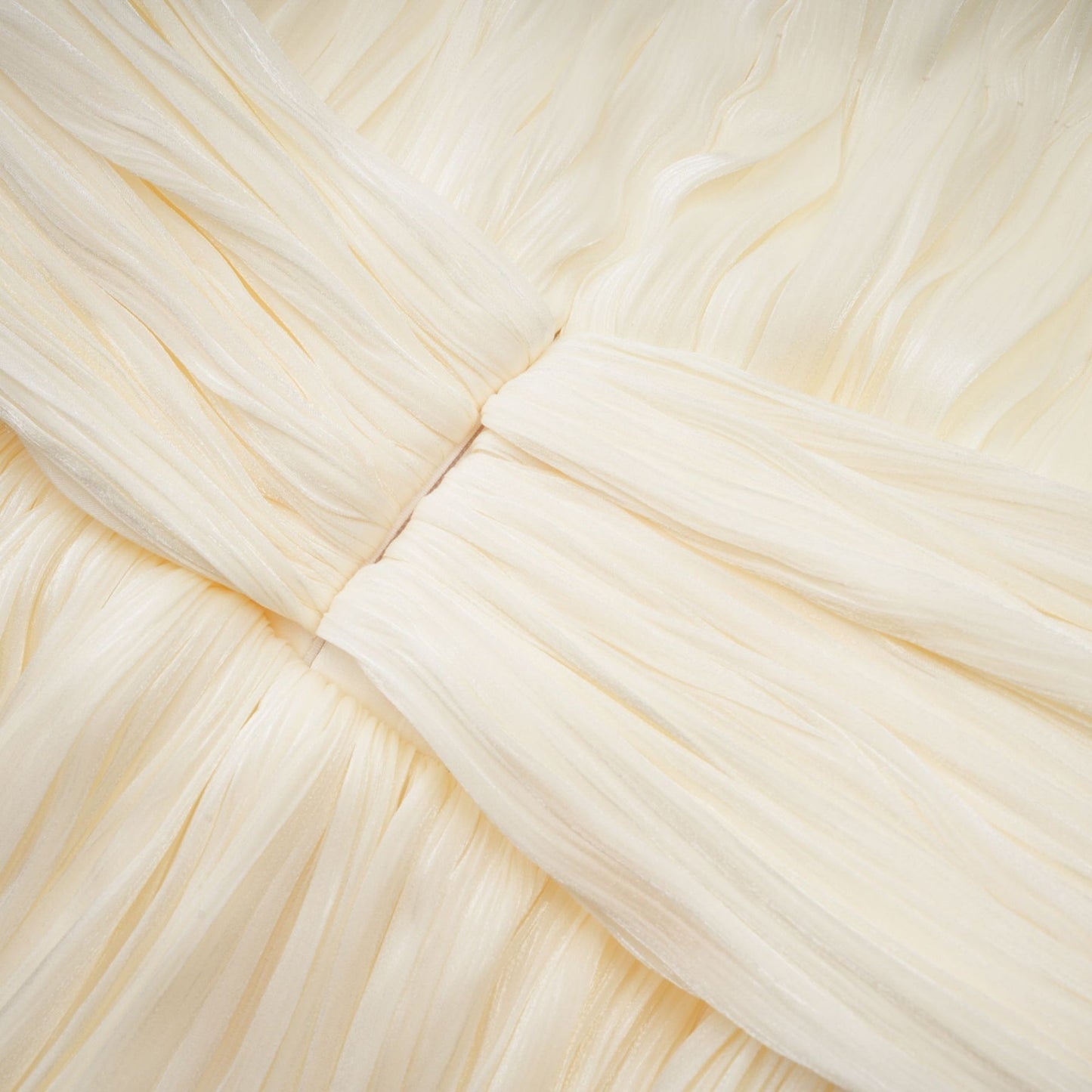 Cyrielle pleated mini dress with ribbon design accent shown on a model against a plain background