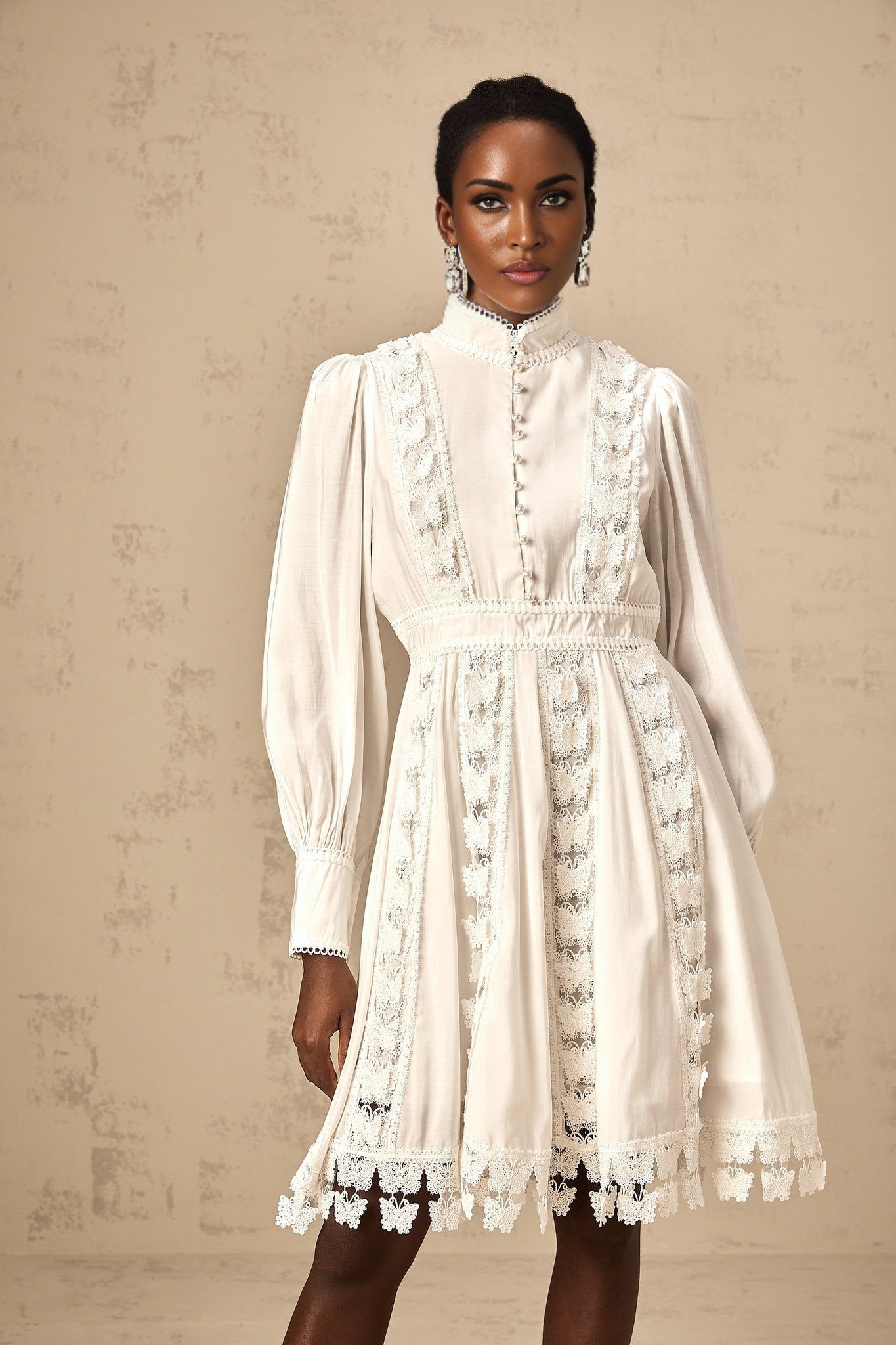 Cyrielle white mini dress featuring delicate butterfly appliques on the fabric